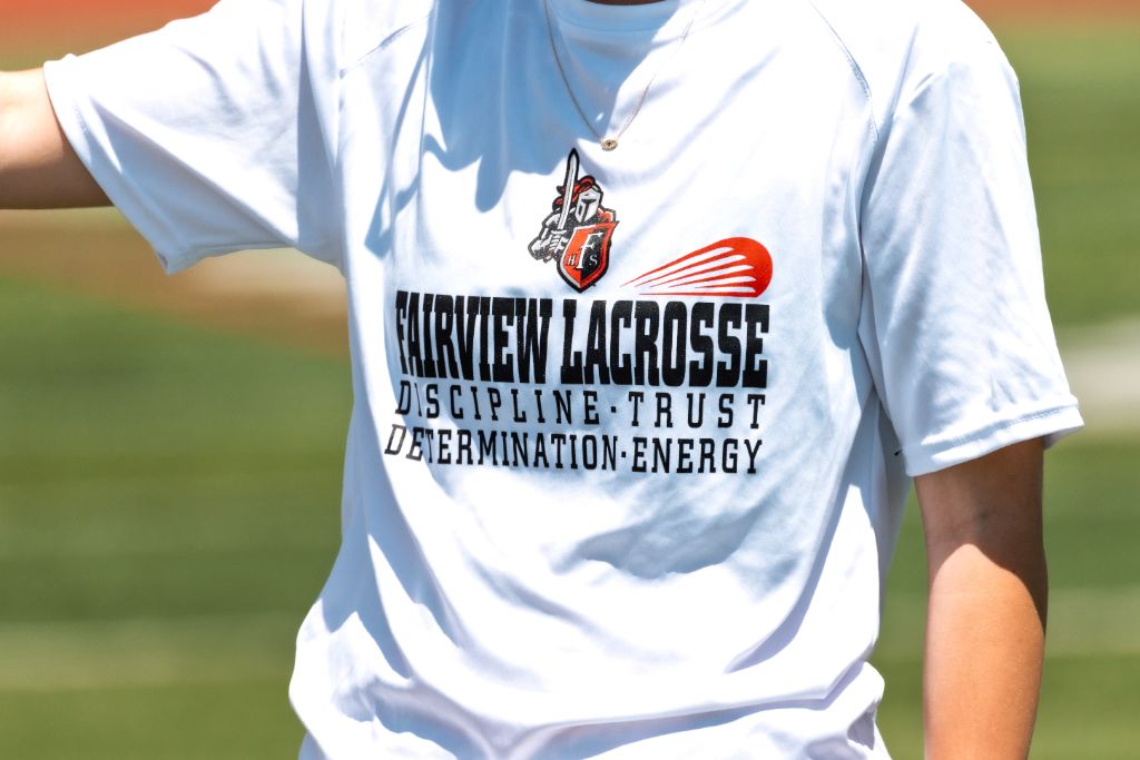 Close-up of a Fairview Lacrosse practice shirt printed with Discipline, Trust, Determination, Energy